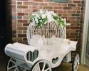 Bring your doves down the aisle in an enchanting white caged carriage. 